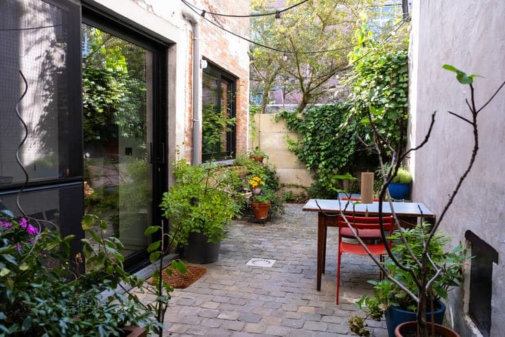Charming townhouse with garage and a sunny city courtyard.