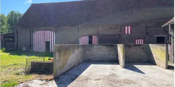 Farmhouse with farm buildings