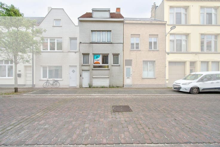 A family home in need of some updating, with a sunny cour...