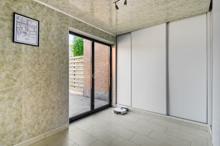 Rustig & centraal gelegen rijwoning met 3 SLK, tuin & garage