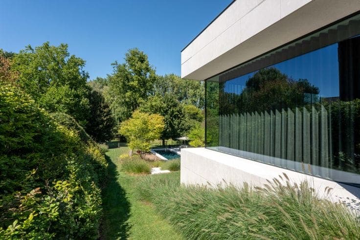 Pure architecture with serene pond views