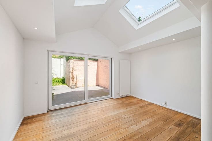 Renovated, sunny city home with a landscaped garden.