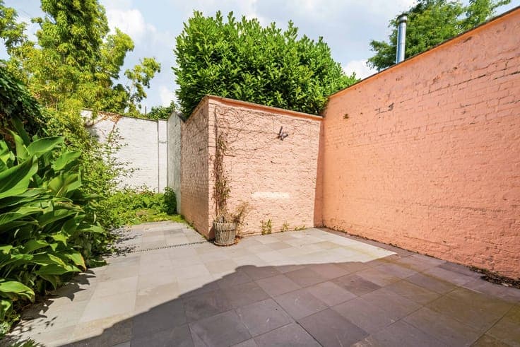Renovated, sunny city home with a landscaped garden.