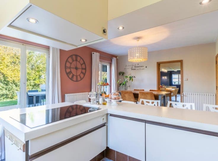 Stunning detached villa nestled in a lush green setting.