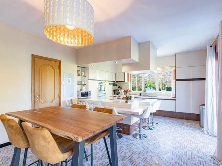 Stunning detached villa nestled in a lush green setting.