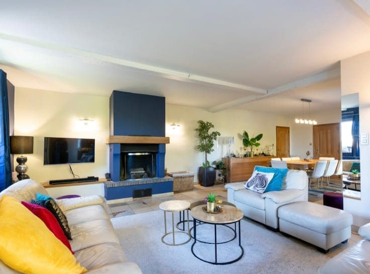 Stunning detached villa nestled in a lush green setting.