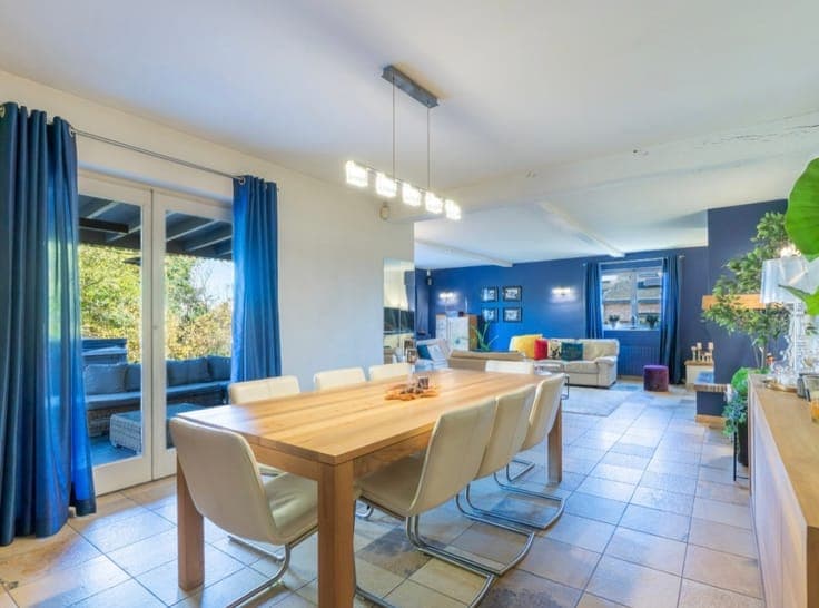 Stunning detached villa nestled in a lush green setting.