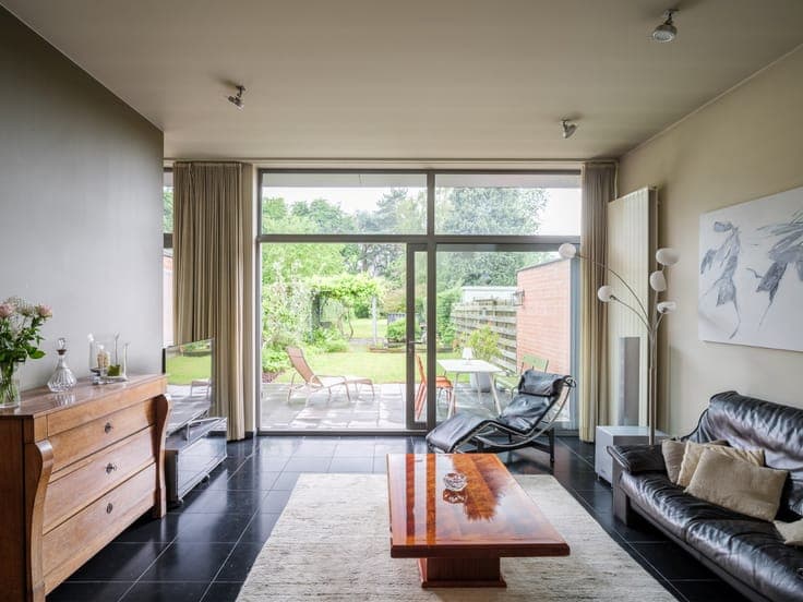 Turnkey home with abundant light and beautiful garden exper