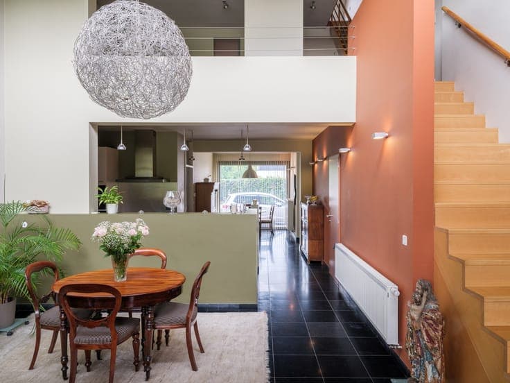 Turnkey home with abundant light and beautiful garden exper