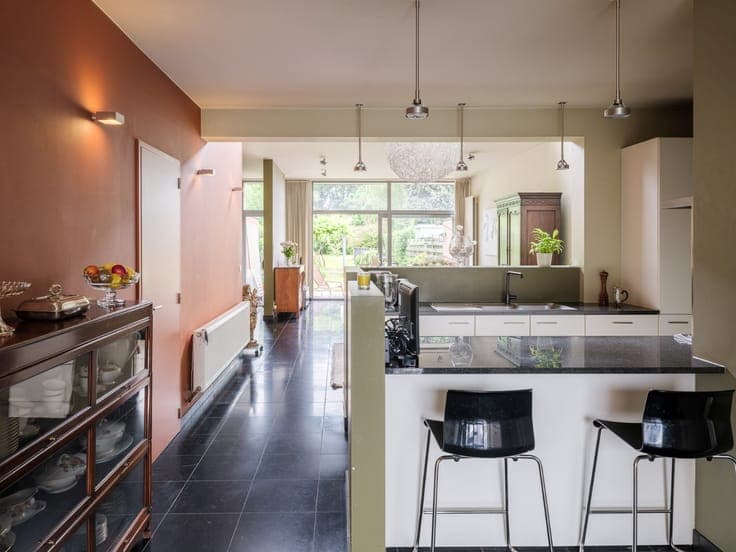 Turnkey home with abundant light and beautiful garden exper