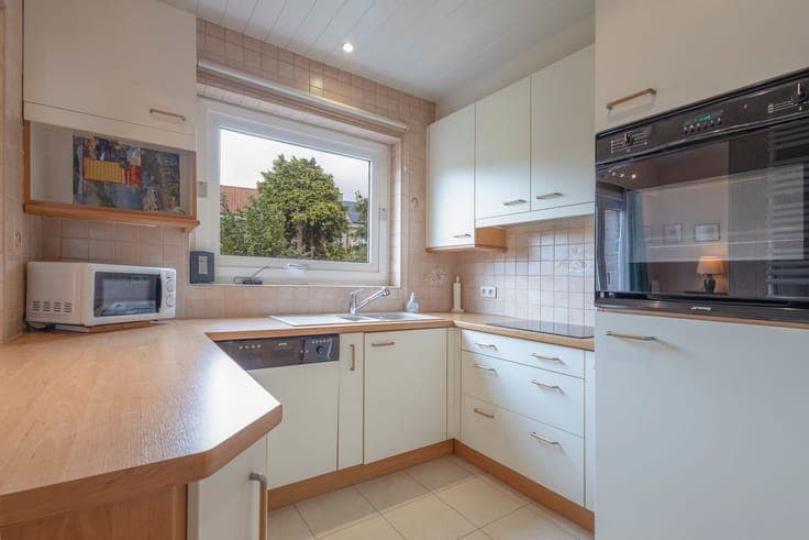 Well-maintained bel-étage home with garden and garage.
