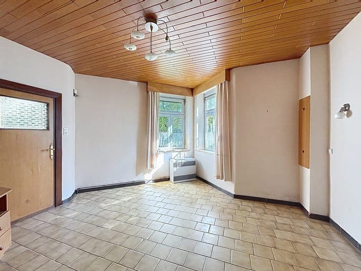 Maison 3 façades avec jardin et garage