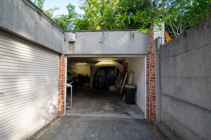 Income-producing property – 4 apartments + 5 garage boxes –