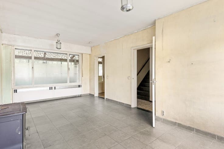 Te renoveren woning met 3 slpk., garage en tuin