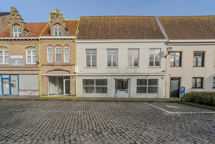 Residential property with commercial space in the center of