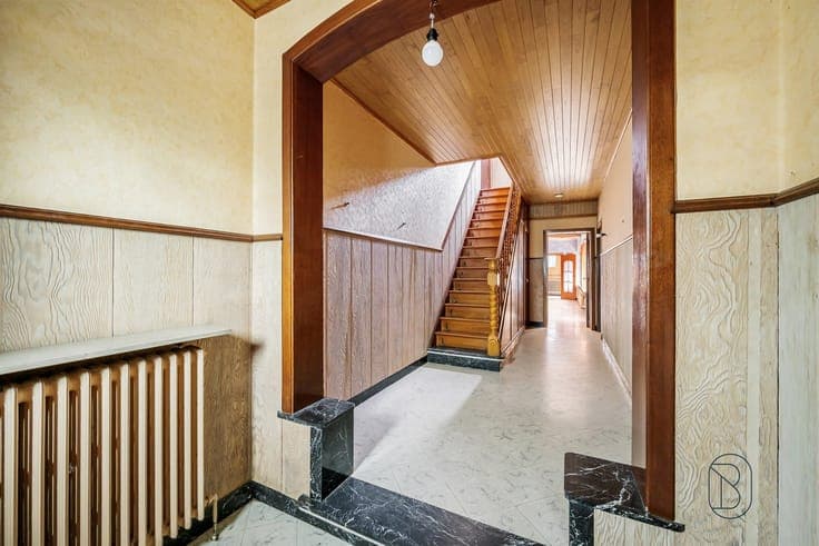 Spacious home in need of renovation with 4 bedrooms and a ga