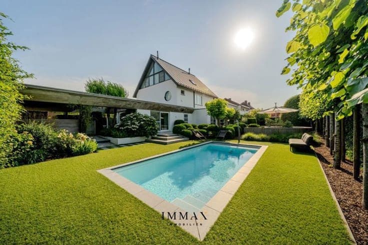 Exclusive living with swimming pool, surrounded by greenery