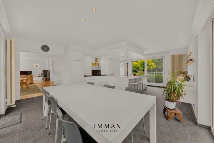 Exclusive living with swimming pool, surrounded by greenery