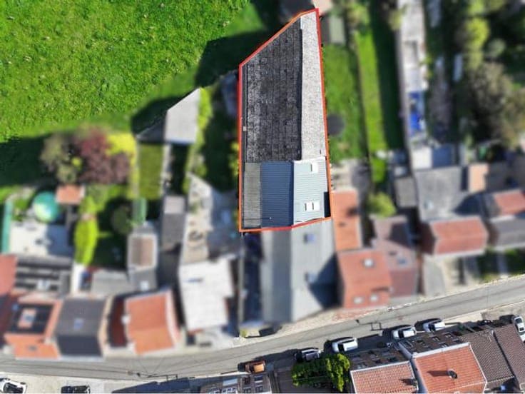 Mixed-use building with duplex, garages & storage in Ans