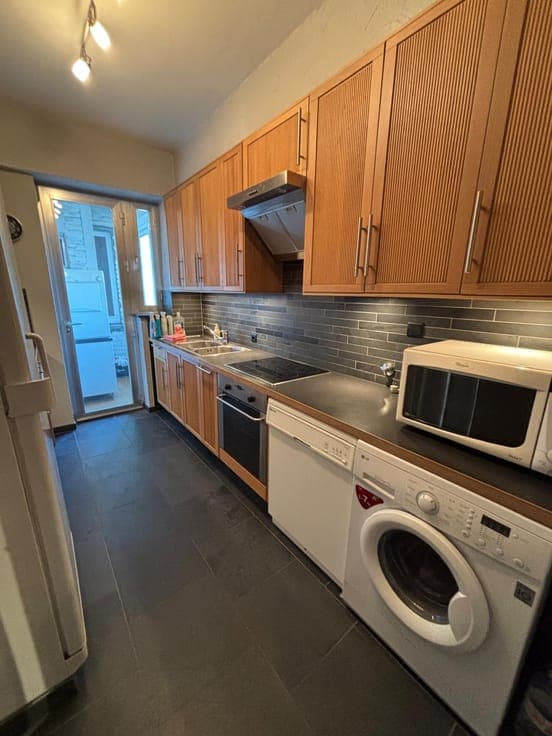 Investment property comprising a large garage (83m²) and 2 f