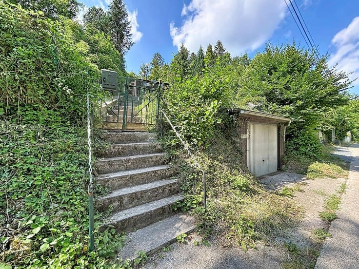 A property with several buildings in peaceful surroundings
