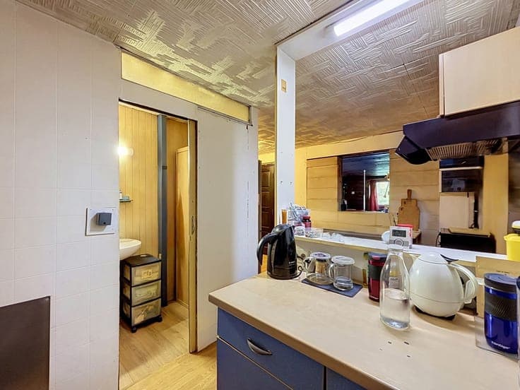 A property with several buildings in peaceful surroundings