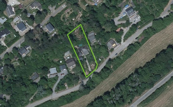 A property with several buildings in peaceful surroundings