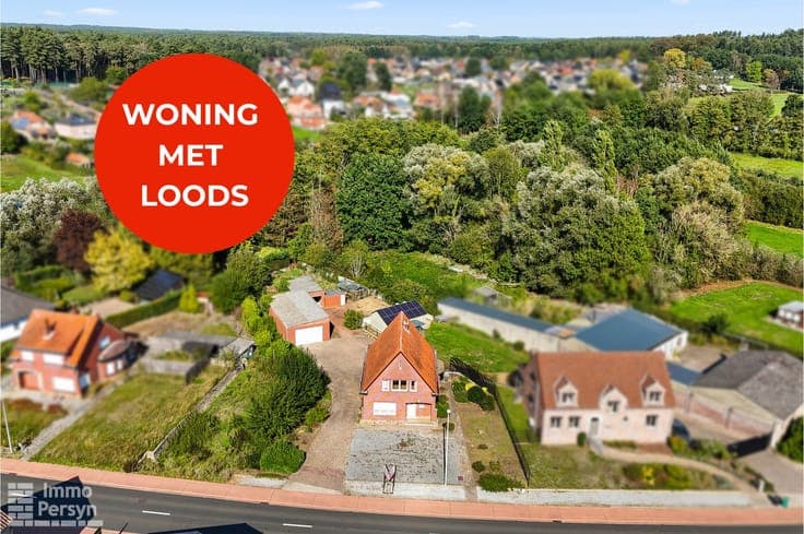 Woning met loods op een commerciële ligging