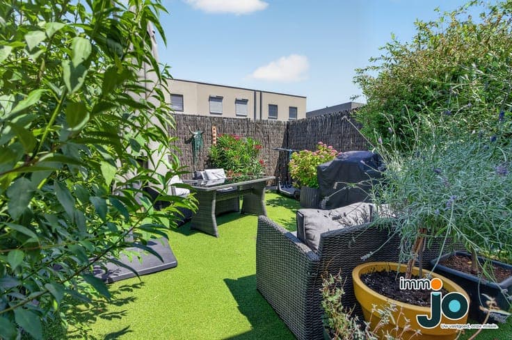 A modern, move-in-ready two-bedroom house with a lovely g...