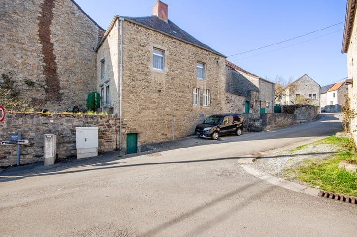 Old farmhouse in the heart of the village with outbuildings