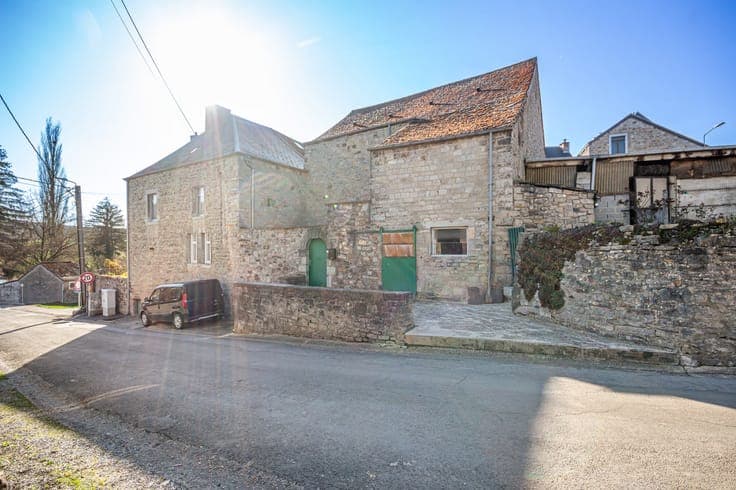 Old farmhouse in the heart of the village with outbuildings