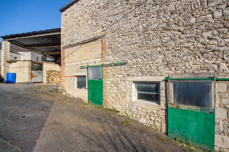 Old farmhouse in the heart of the village with outbuildings