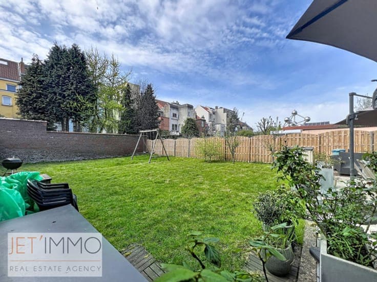 Beautiful two-family home or investment property with a gard