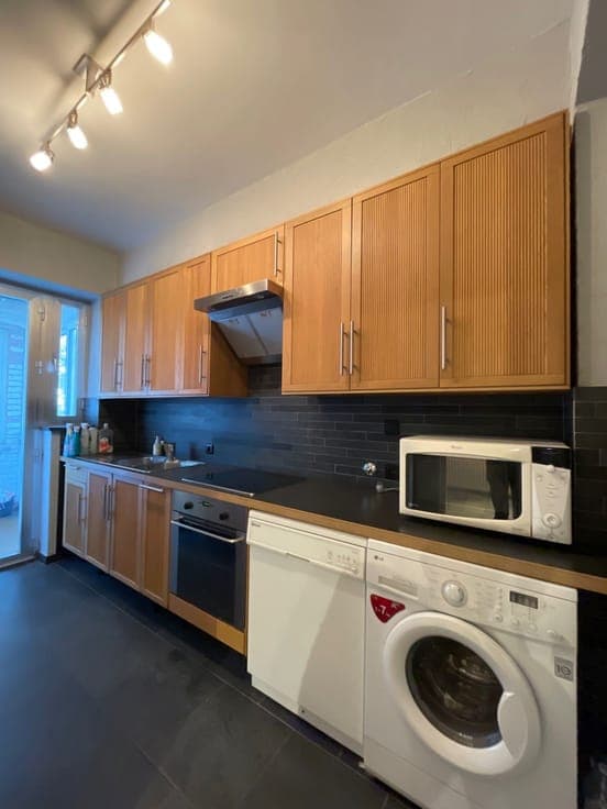 Investment property comprising a large garage (83m²) and 2 f