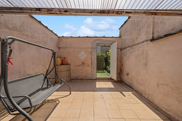 Surprisingly spacious home with unique rear access!