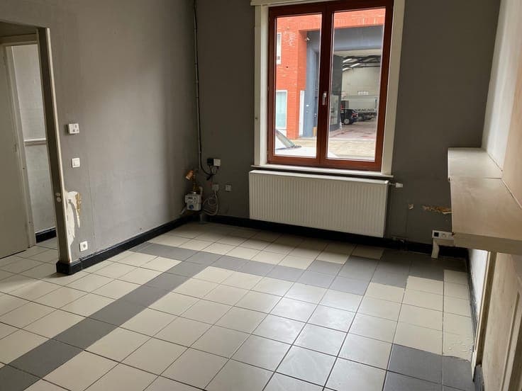 Centraal gelegen rijwoning met 2 slaapkamers.