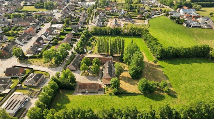 EXCEPTIONAL square farmhouse with numerous possibilities!
