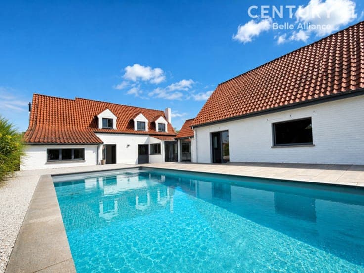 A charming home with a pool and a separate living area