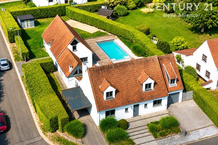 A charming home with a pool and a separate living area