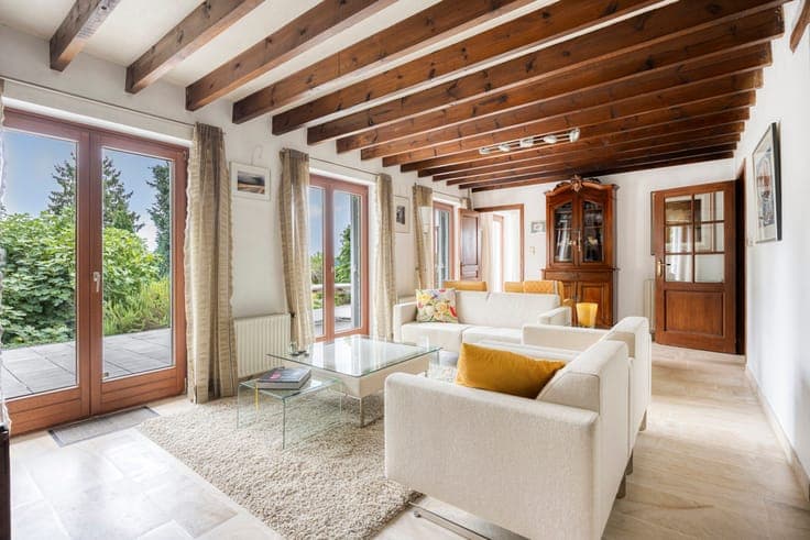 Set-back villa with private driveway and field views