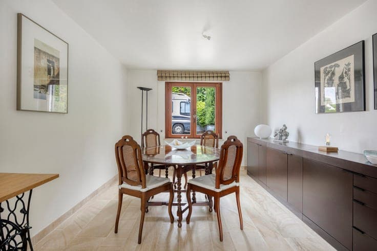 Set-back villa with private driveway and field views