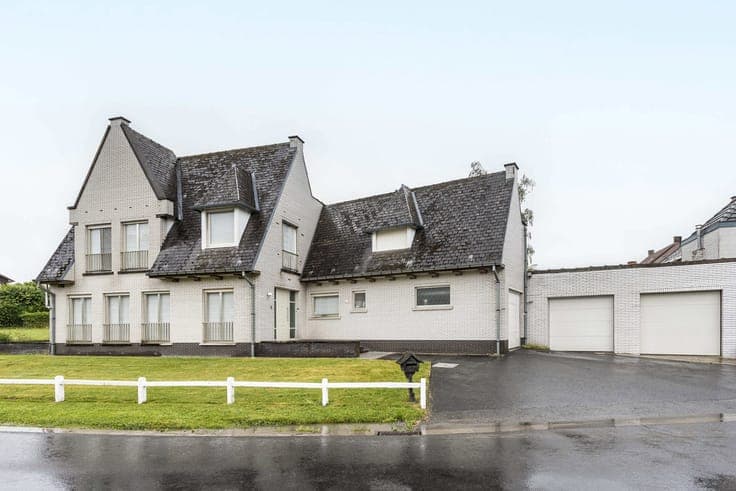 Unique property with driveway, garden & garages.
