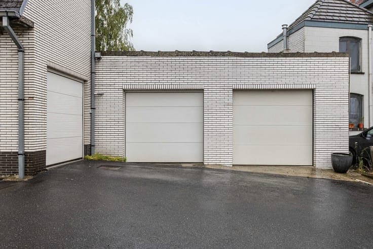 Unique property with driveway, garden & garages.