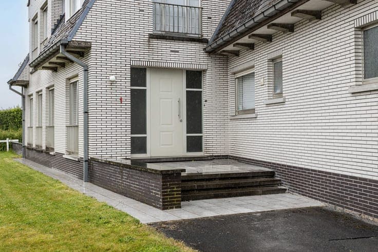 Unique property with driveway, garden & garages.