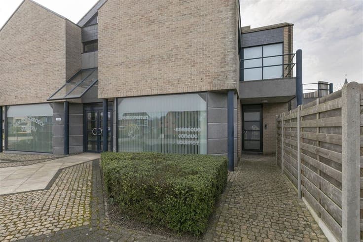 Revenue property consisting of commercial store and 2 apartm