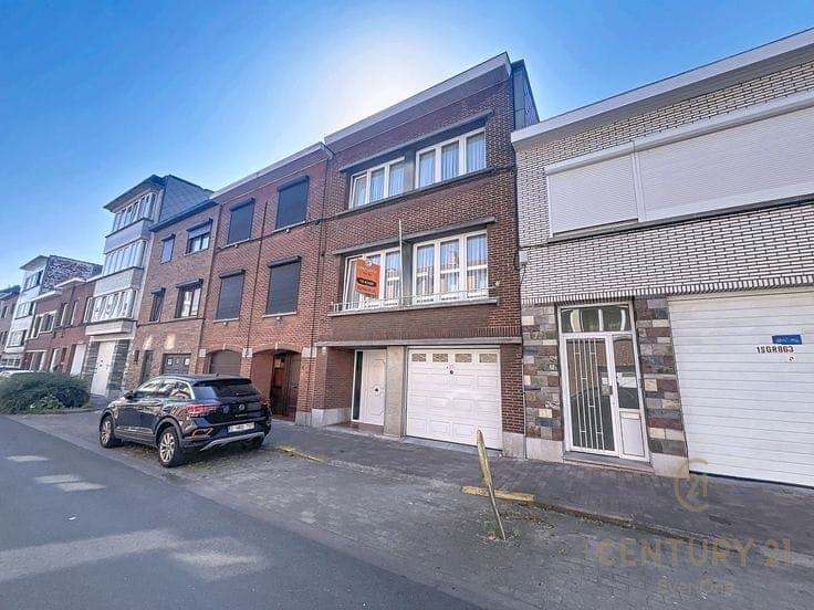 split-level house with garage and garden