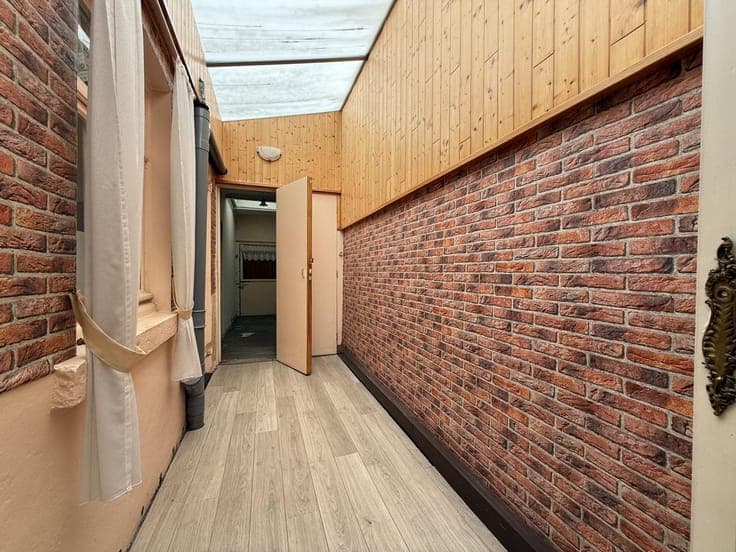 Zeer interessante rijwoning met 3 of 4 slaapkamers en tui...