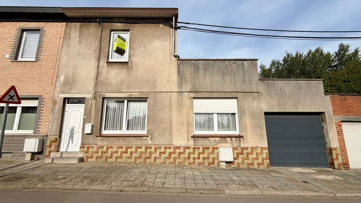 Investissement: maison actuellement louée avec garage
