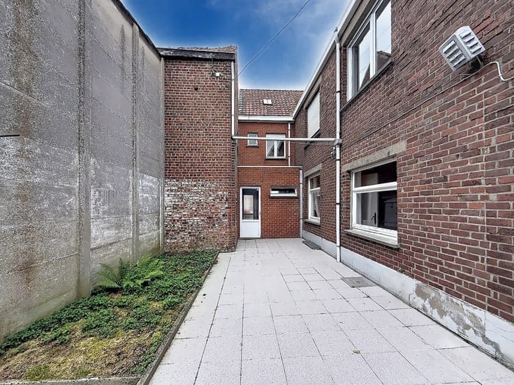 A spacious four-bedroom house with a large storage room in