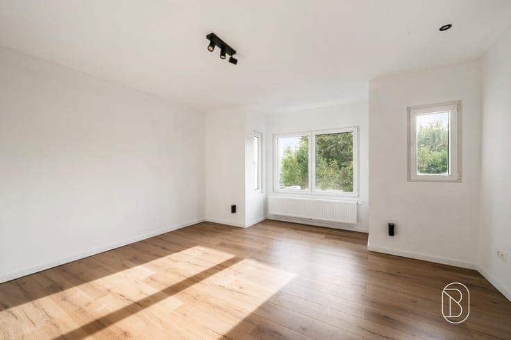A move-in-ready, energy-efficient 4-bedroom home with a gard